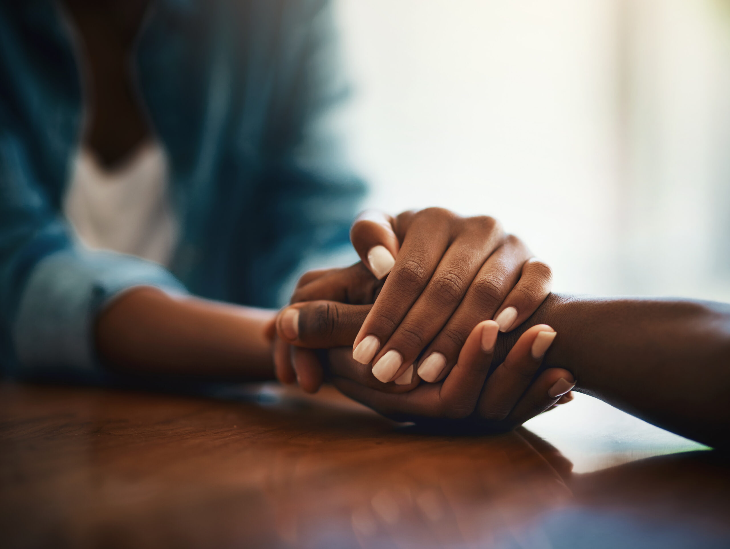 hands clasped together