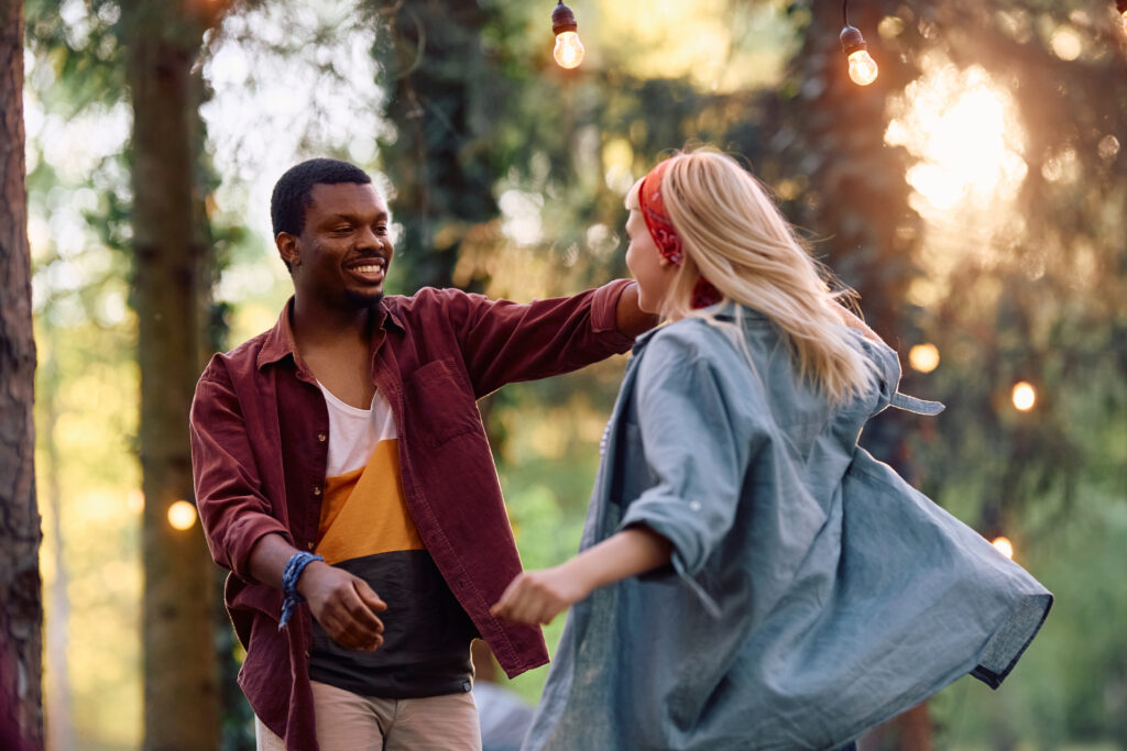 affectionate-couple-dancing-outdoors-in-natural