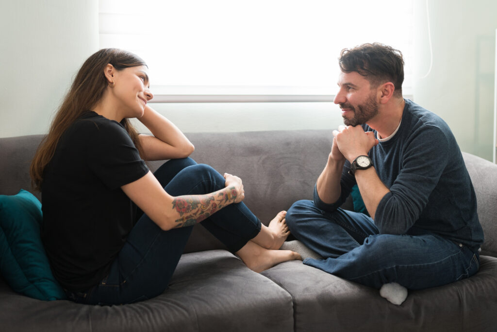 Attractive and loving couple talking about their feelings